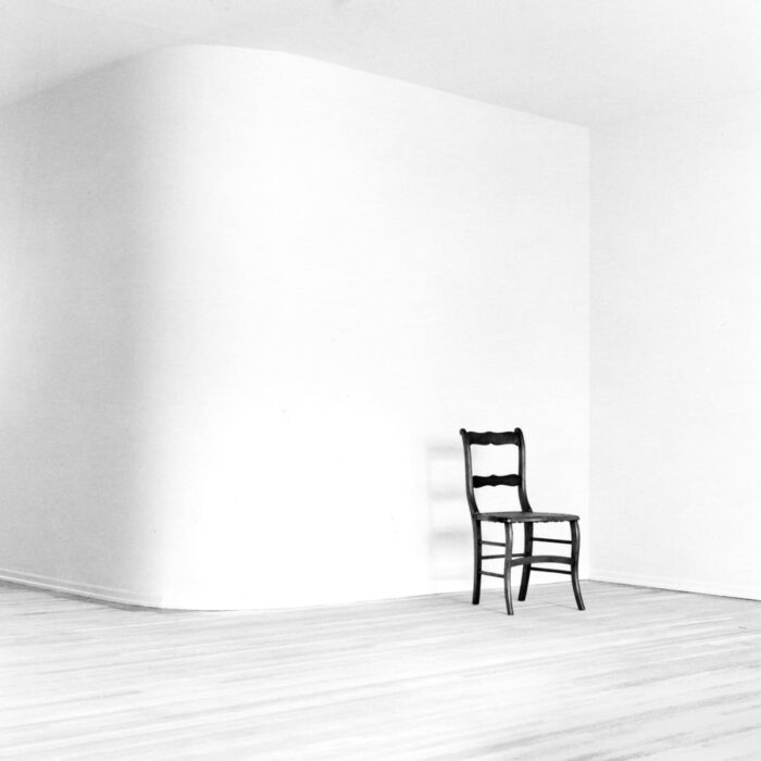 arnold kastenbaum chair in empty room